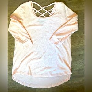 Soft, light pink, strappy back detail top.